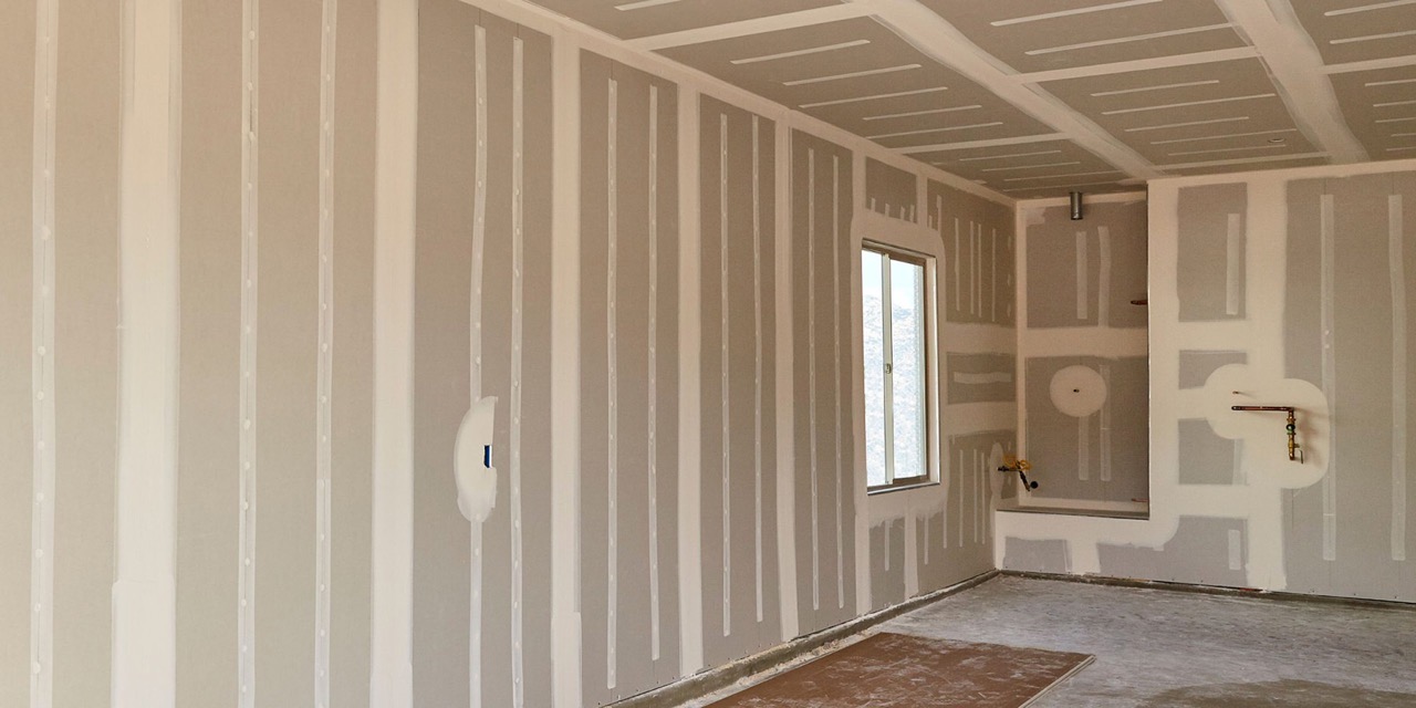 The image shows an interior space with walls partially covered by vertical panels or planks, suggesting a construction or renovation setting.