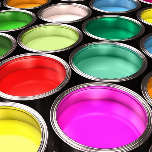 A collection of colorful paint cans arranged neatly in rows.