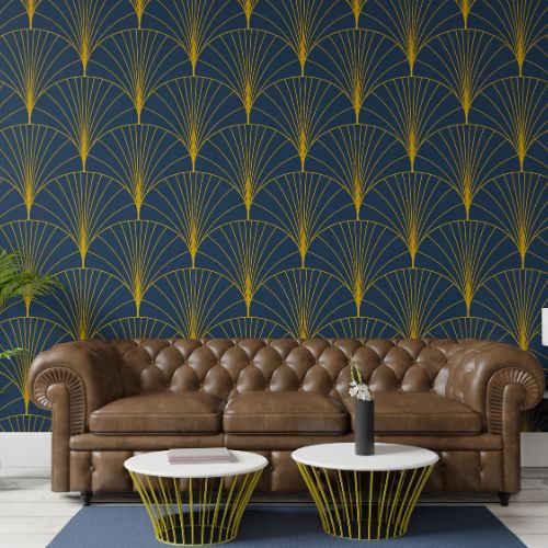 The image shows a wall with a blue background featuring a repeating pattern of abstract geometric shapes resembling stylized waves or rays, set against a darker blue backdrop that suggests a night sky effect.